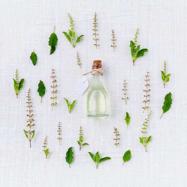 Glass Bottle surrounded by herbs | Archer Volkswagen Houston, TX